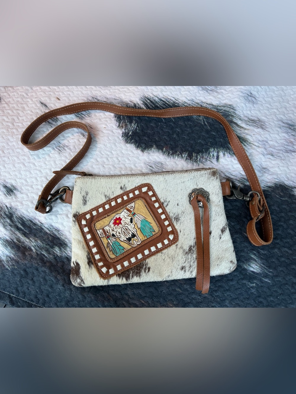 Myra Bag White and Brown Cowhide Crossbody with Western Patch Back has wear